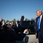 Donald Trump taking questions from the media at Palm Beach International Airport on March 23, 2026. (White House photo by Molly Riley)
