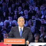 Viktor Orbán on February 14, 2026. The podium reads, “The Safe Choice,” the motto of his Fidesz party. (Photo: Elekes Andor/Wikimedia)