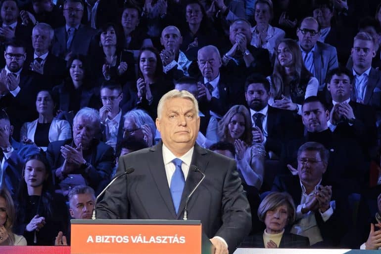 Viktor Orbán on February 14, 2026. The podium reads, “The Safe Choice,” the motto of his Fidesz party. (Photo: Elekes Andor/Wikimedia)
