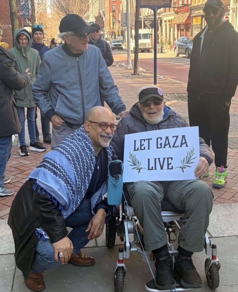 Chris Rabb takes a photo with a supporter at a vigil outside Sen. John Fetterman's Philadelphia office on February 27, 2026. (Photo: Instagram/chrisrabb)