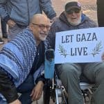 Chris Rabb takes a photo with a supporter at a vigil outside Sen. John Fetterman's Philadelphia office on February 27, 2026. (Photo: Instagram/chrisrabb)