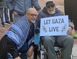 Chris Rabb takes a photo with a supporter at a vigil outside Sen. John Fetterman's Philadelphia office on February 27, 2026. (Photo: Instagram/chrisrabb)