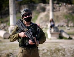 Israeli soldiers patrolling Roman-era ruins in the Palestinian town of Sebastia, March 30, 2021. (Photo: Shadi Jarar'ah/APA Images)