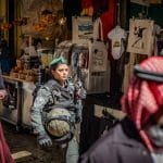 An Israeli soldier walks among Muslim worshippers in the Old City on the last Friday of the holy month of Ramadan, April 5, 2024. (Photo: © Ilia Yefimovich/dpa via ZUMA Press/APA Images)
