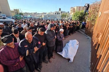 Palestinians attend the funeral of Nassim al-Kalazani, a police colonel who was killed in an Israeli strike targeting his vehicle, in Khan Younis, in the southern Gaza Strip, on May 6, 2026. (Photo: Tariq Mohammad / APA Images)