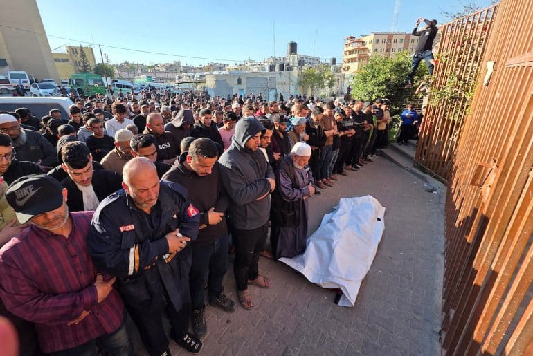 Palestinians attend the funeral of Nassim al-Kalazani, a police colonel who was killed in an Israeli strike targeting his vehicle, in Khan Younis, in the southern Gaza Strip, on May 6, 2026. (Photo: Tariq Mohammad / APA Images)