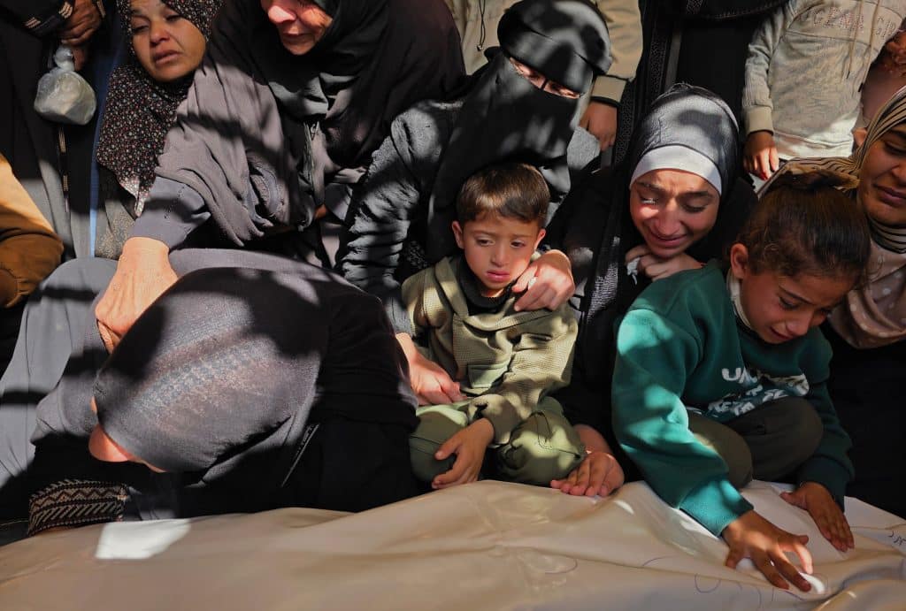 Palestinians bid farewell to the bodies of eight Palestinians killed in an Israeli strike targeting a police vehicle in the Mawasi area of Khan Younis, southern Gaza Strip, April 25, 2026. (Photo: Tariq Mohammad/APA Images)