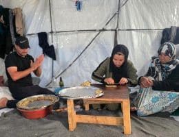 A displaced Palestinian family prepares traditional Eid cookies in their tent in Khan Younis, south Gaza, May 26, 2026. (Photo: Tariq Mohammad/APA Images)