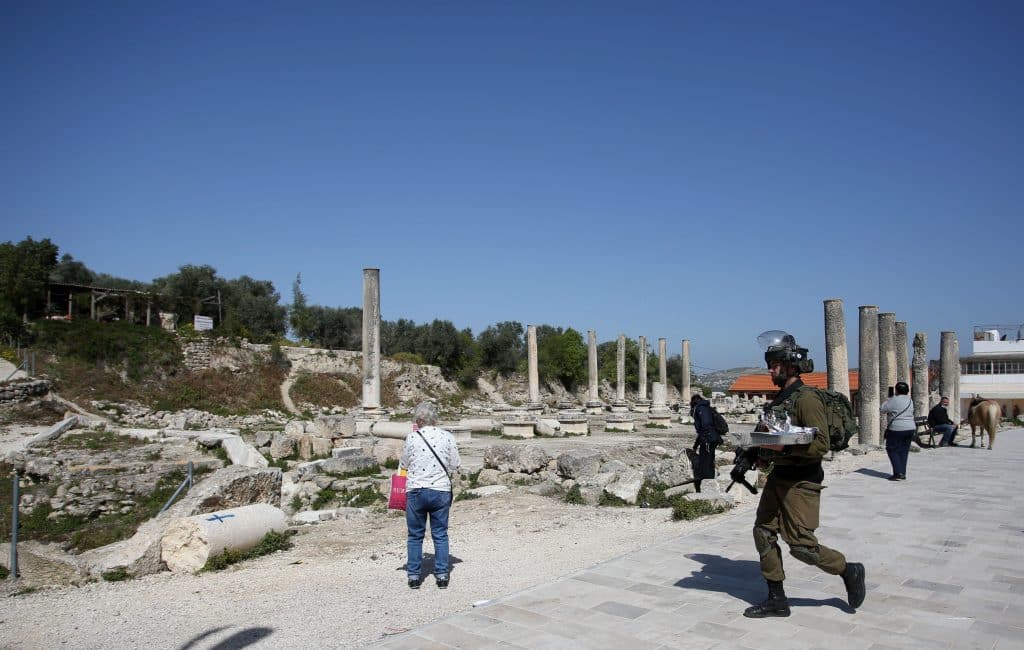 Israeli soldiers patrolling Roman-era ruins in the Palestinian town of Sebastia, March 30, 2021. (Photo: Shadi Jarar'ah/APA Images)