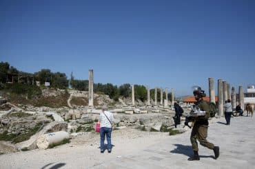 Israeli soldiers patrolling Roman-era ruins in the Palestinian town of Sebastia, March 30, 2021. (Photo: Shadi Jarar'ah/APA Images)