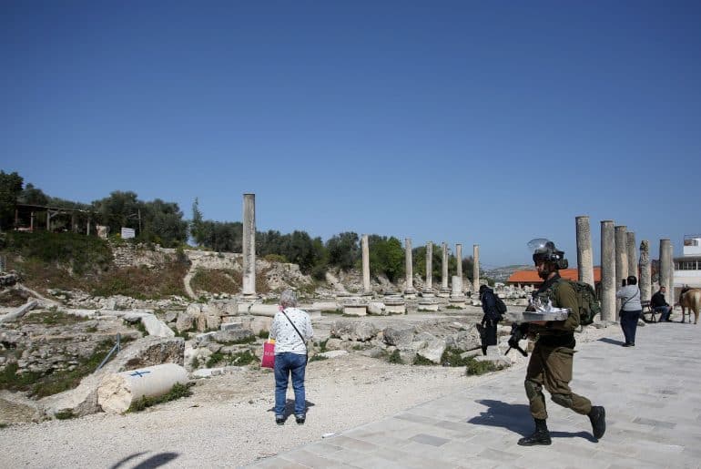 Israeli soldiers patrolling Roman-era ruins in the Palestinian town of Sebastia, March 30, 2021. (Photo: Shadi Jarar'ah/APA Images)