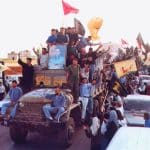 Hezbollah members and supporters parade following the end of Israel's occupation of southern Lebanon, May 2000. (Photo: Wikimedia Commons)