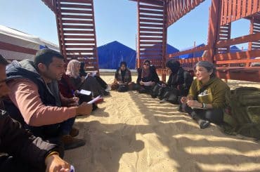 susan abulhawa, right, meeting with writers in Gaza in early 2024 for workshops that led to the book, "Every Moment Is A Life."