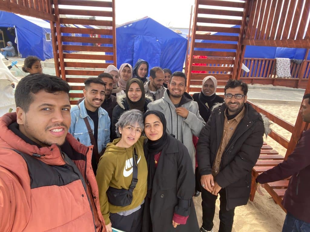 susan abulhawa, center, with the writers featured in the book "Every Moment Is A Life," in Gaza in early 2024.