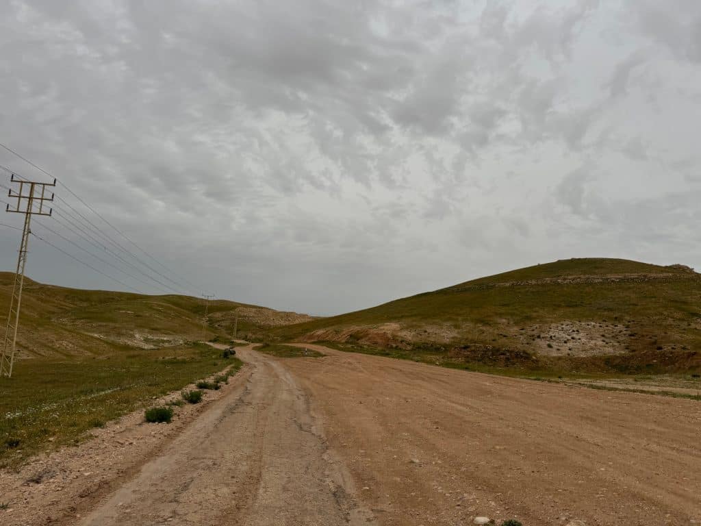 The road to Khan al-Ahmar, one of 46 Bedouin communities threatened with forced displacement to make way for Israel's E1 settlement project around Jerusalem, May 2026. (Photo: Shatha Hammad)