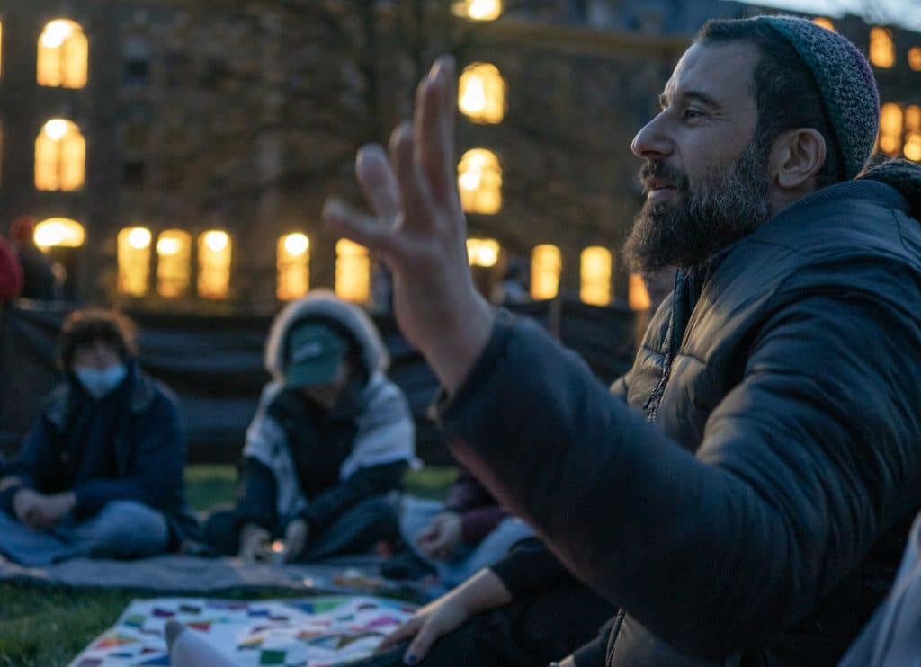 Michael Margolin leads a Shabbat service at the Cornell University Gaza Solidarity Encampment on April 23, 2024, in Ithaca, NY. (Photo: Caleb Kaufman)