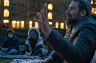 Michael Margolin leads a Shabbat service at the Cornell University Gaza Solidarity Encampment on April 23, 2024, in Ithaca, NY. (Photo: Caleb Kaufman)