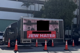 A redacted photo of a billboard truck allegedly hired by Miami Beach city commissioner David Suarez, submitted as an exhibit in a lawsuit filed by Jewish Voice for Peace of South Florida. (Screenshot: U.S. District Court, Southern District of Florida)