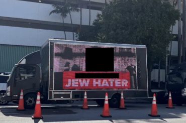 A redacted photo of a billboard truck allegedly hired by Miami Beach city commissioner David Suarez, submitted as an exhibit in a lawsuit filed by Jewish Voice for Peace of South Florida. (Screenshot: U.S. District Court, Southern District of Florida)