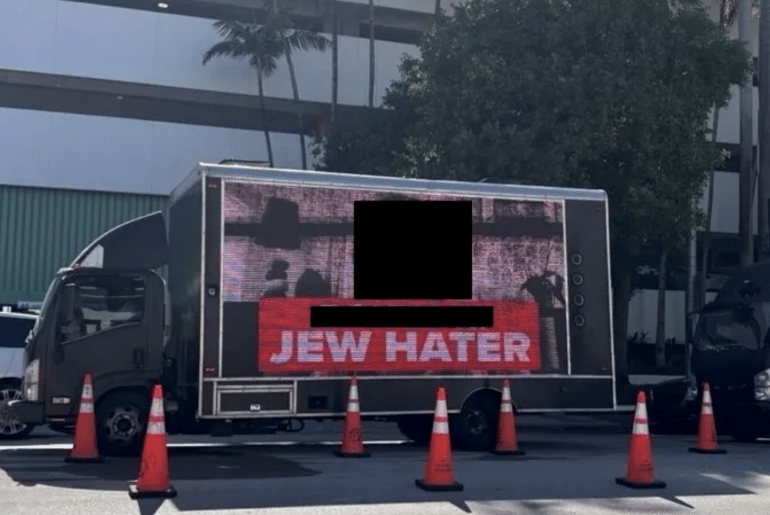 A redacted photo of a billboard truck allegedly hired by Miami Beach city commissioner David Suarez, submitted as an exhibit in a lawsuit filed by Jewish Voice for Peace of South Florida. (Screenshot: U.S. District Court, Southern District of Florida)