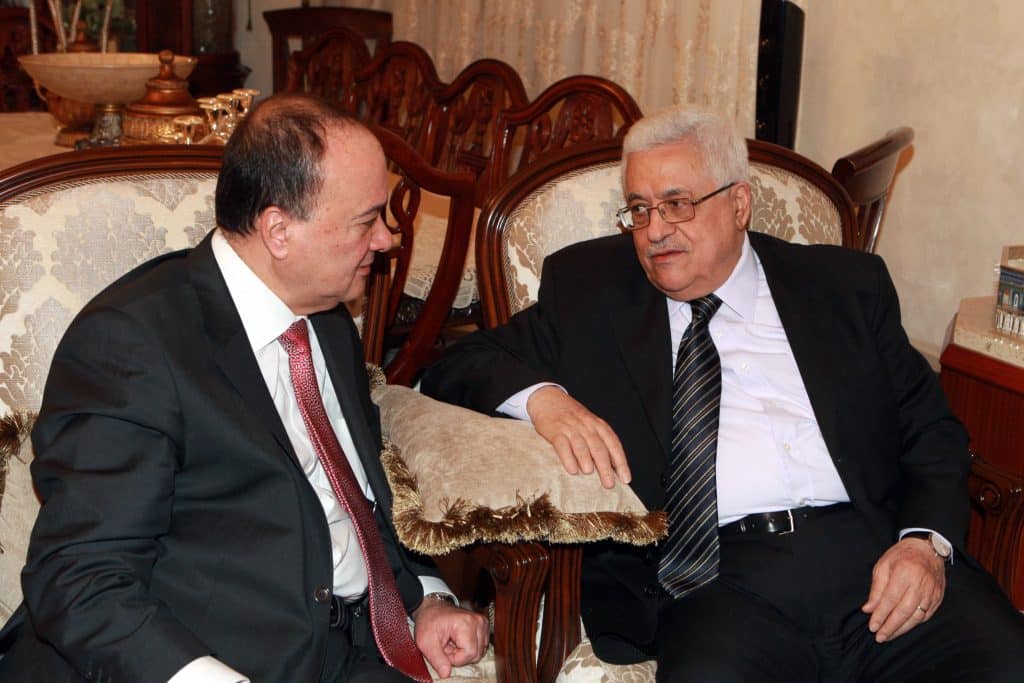 Palestinian Authority President Mahmoud Abbas (right) meeting with senior Fatah member Nasser al-Qudweh in Jordan, May 18, 2012. (Photo: Thaer Ganaim/APA Images)