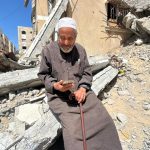 Ismail Atiya Nasir al-Din, 91, sits amid the rubble of his destroyed home in Gaza, displaced for a second time in his life after surviving the Nakba of 1948. (Photo courtesy of the author)