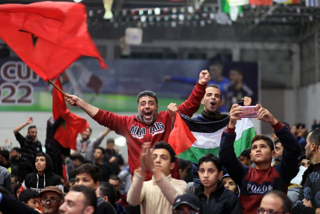 Palestinian fans celebrate after Morocco's victory over Spain in the 2022 World Cup in Qatar, Gaza City, December 6, 2022. (Photo: Ali Hamad/APA Images)