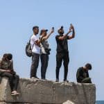 Journalists attempt to get an internet connection on their phones in Gaza City after internet and phone services collapsed across the Strip on June 13, 2025, during the height of the war. (Photo: Omar Ashtawy/APA Images)
