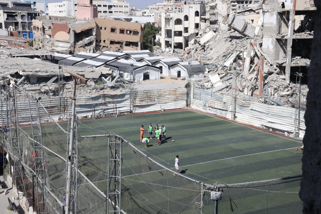 Palestinian footballer Saif Wael Bilal, 19, who lost his leg in the war, trains on a damaged football pitch in Gaza City on June 18, 2026, during the 2026 FIFA World Cup. (Photo: Bilal Osama/APA Images)
