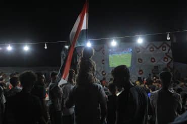 The Egyptian Relief Committee organized a rare public screening of the World Cup match between Egypt and Beligum, providing electricity, screens, and an internet connection, June 15, 2026. (Photo: Mazen Breem)