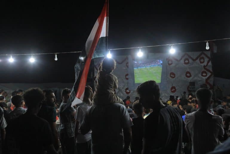 The Egyptian Relief Committee organized a rare public screening of the World Cup match between Egypt and Beligum, providing electricity, screens, and an internet connection, June 15, 2026. (Photo: Mazen Breem)
