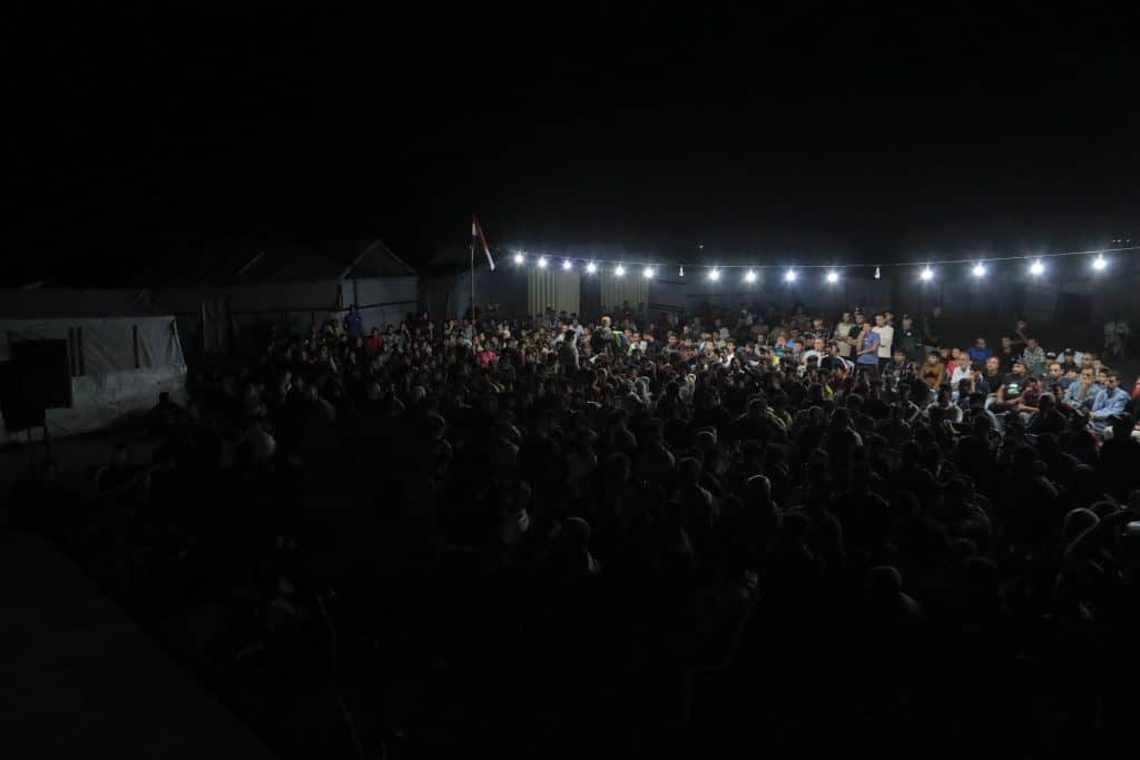 The Egyptian Relief Committee organized a rare public screening of the World Cup match between Egypt and Beligum, providing electricity, screens, and an internet connection, June 15, 2026. (Photo: Mazen Breem)
