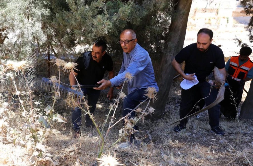 Volunteers clean the area near Solomon's Pools in Artas, outside of Bethlehem, June 2026. (Photo: Majd Jawad)