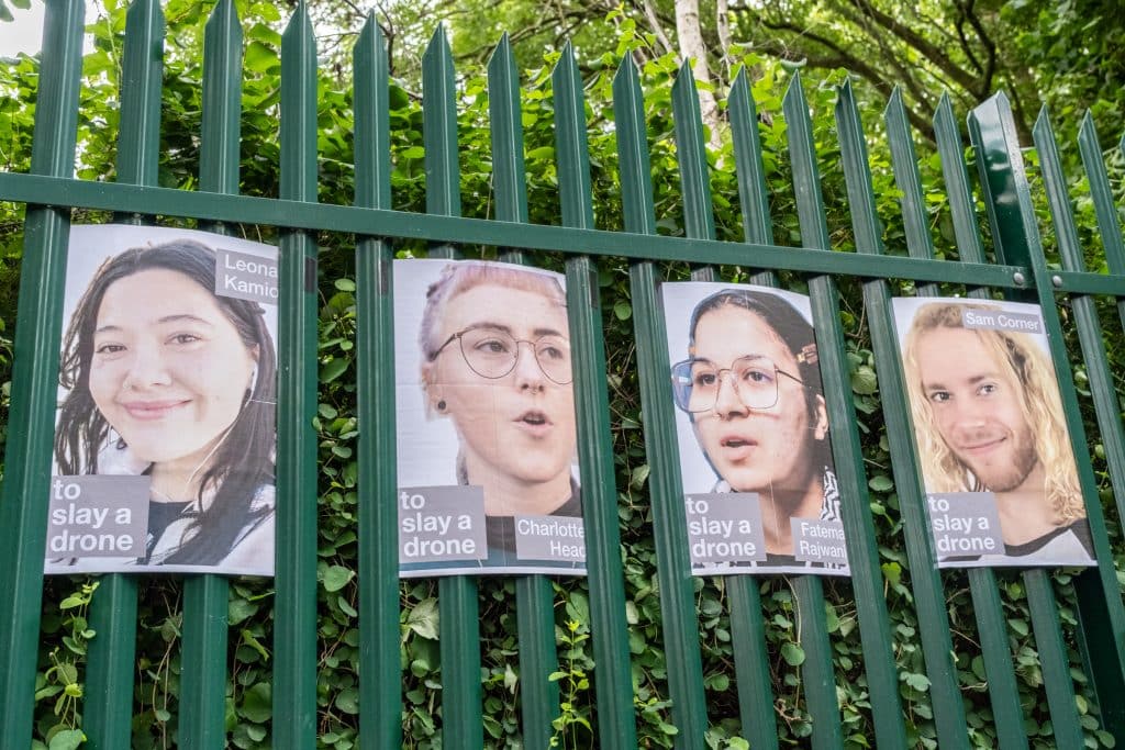 Posters of Palestine Action activists on trial, displayed on the gates of Woolwich Crown Court. (Photo: Aidan Frere-Smith)