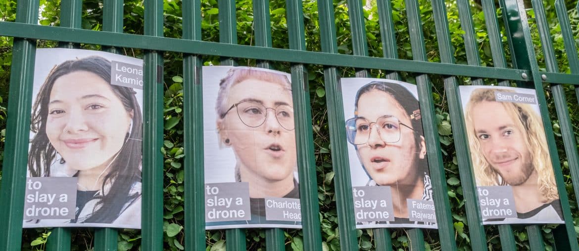 Posters of Palestine Action activists on trial, displayed on the gates of Woolwich Crown Court. (Photo: Aidan Frere-Smith)