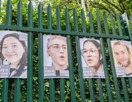 Posters of Palestine Action activists on trial, displayed on the gates of Woolwich Crown Court. (Photo: Aidan Frere-Smith)