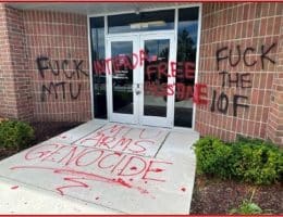 Property damage to a Rolls-Royce facility in Novi, Michigan, which had phrases such as “MTU ARMS GENOCIDE” and “FREE PALESTINE” painted on its exterior. Rolls-Royce produces parts for Israeli army vehicles. MTU is Rolls-Royce’s German subsidiary, which makes the engines for the Israeli army’s Merkava tanks. (Photo via US DOJ)