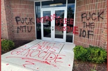 Property damage to a Rolls-Royce facility in Novi, Michigan, which had phrases such as “MTU ARMS GENOCIDE” and “FREE PALESTINE” painted on its exterior. Rolls-Royce produces parts for Israeli army vehicles. MTU is Rolls-Royce’s German subsidiary, which makes the engines for the Israeli army’s Merkava tanks. (Photo via US DOJ)
