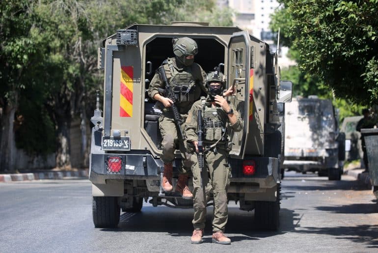 Israeli army deployed in the streets of Nablus during a military operation in the city, July 12, 2026. (Photo: Mohammed Nasser/APA Images)