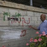 Palestinians inspect damage at the site of an attack carried out by Israeli settlers targeting Palestinian vehicles and property in the town of Surif, northwest of Hebron, May 17, 2026. (Photo: Mamoun Wazwaz/APA Images)