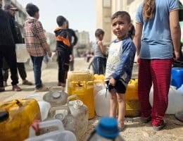 Palestinians in Khan Yunis collect water from tanker trucks and carry it in jerrycans to their homes amid continued water shortages in Gaza, April 18, 2026. (Photo: Tariq Mohammad/APA Images)