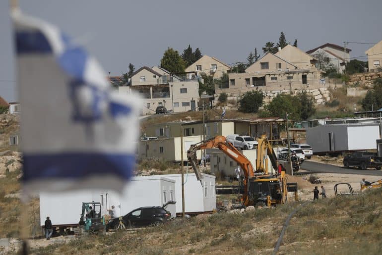 Israeli settlers continue expanding an outpost in the village of Umm al-Khair in the Masafer Yatta community, south of Hebron, May 20, 2026. (Photo: Mamoun Wazwaz/APA Images)