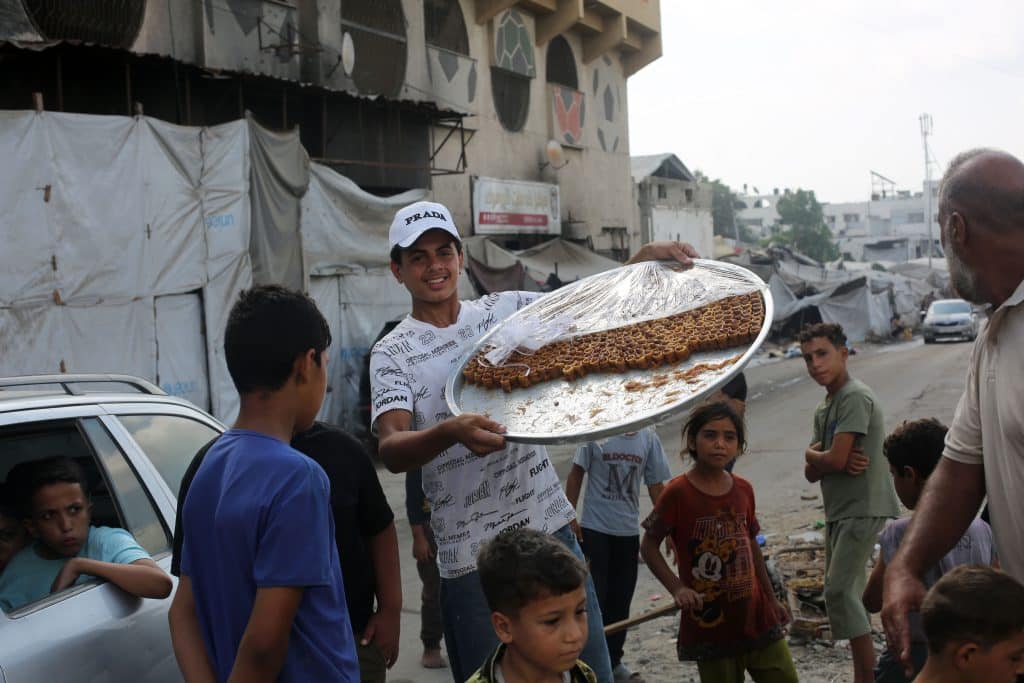 Palestinian students and their families celebrate the announcement of the Tawjihi (high school) examination results, Gaza City, July 24, 2026. (Photo: Mohammed Salha/APA Images)