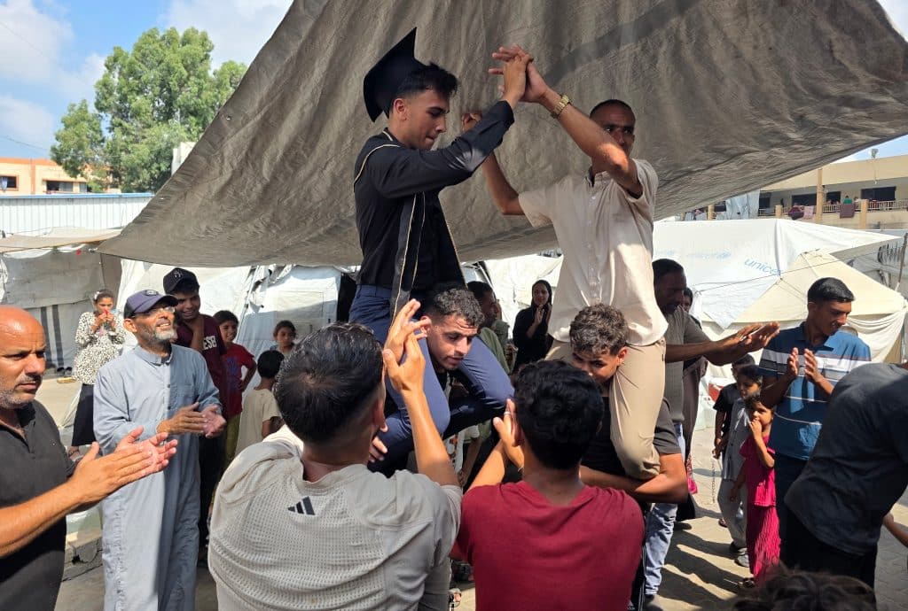 Palestinian students and their families celebrate the announcement of the Tawjihi (high school) examination results, Khan Younis, July 24, 2026. (Photo: Tariq Mohammad/APA Images)