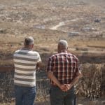 Residents of the Palestinian village of Salem, east of Nablus, look over a newly-established Israeli settler outpost, July 27, 2026. (Photo: Mohammed Nasser/APA Images)