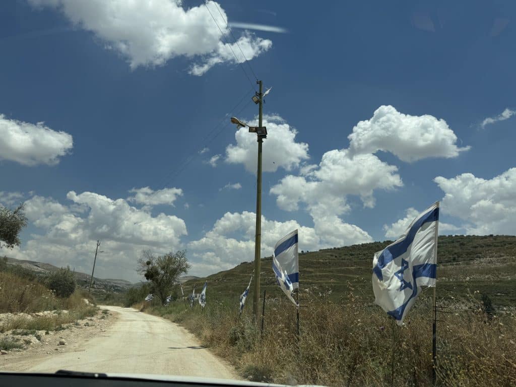 The Masoudiyya area, located on lands belonging to the village of Burqa in the northern West Bank, have come under constant Israeli settler attacks aimed at driving them out of their homes. Israeli settlers have planted Israeli flags along the roads leading to and from the area. (Photo: Shatha Hammad)