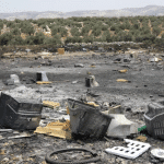 photo of a burned e waste dumping site in the west bank