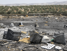 photo of a burned e waste dumping site in the west bank