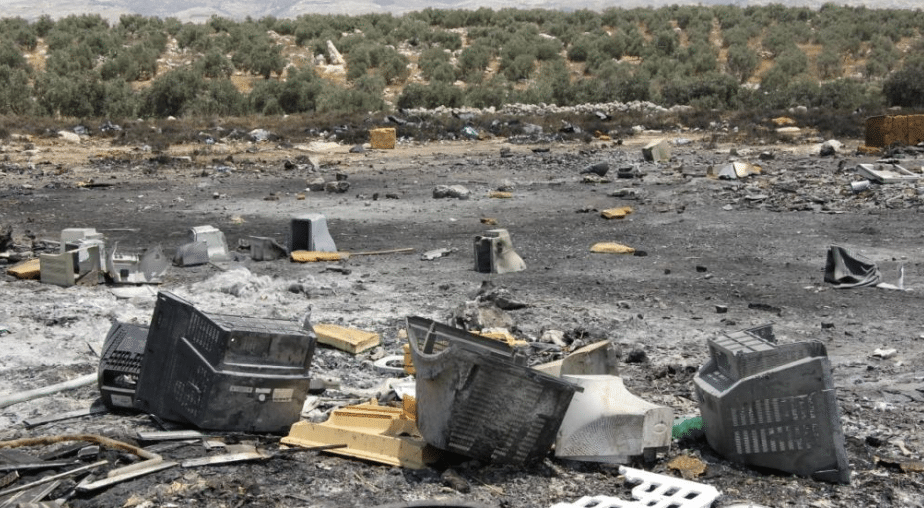 photo of a burned e waste dumping site in the west bank