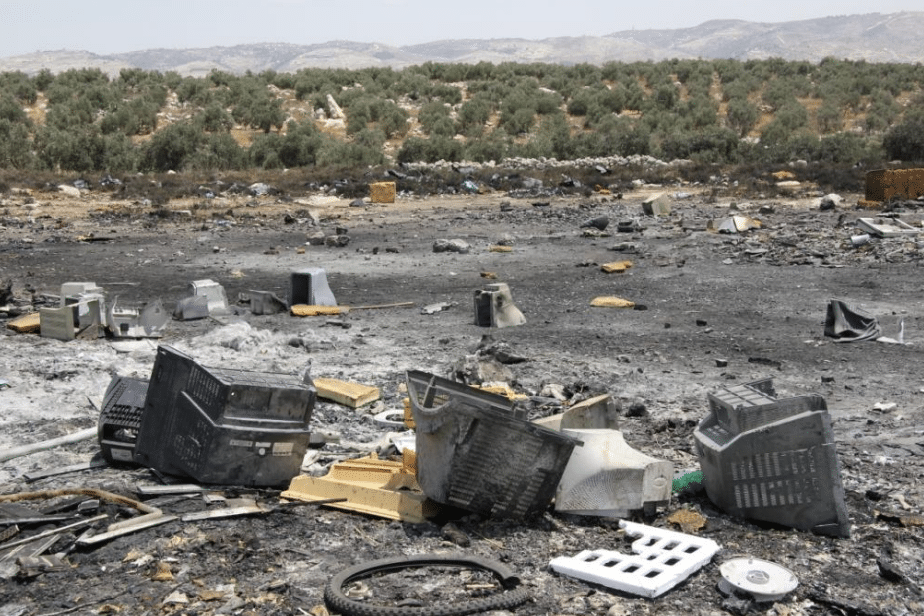 photo of a burned e waste dumping site in the west bank